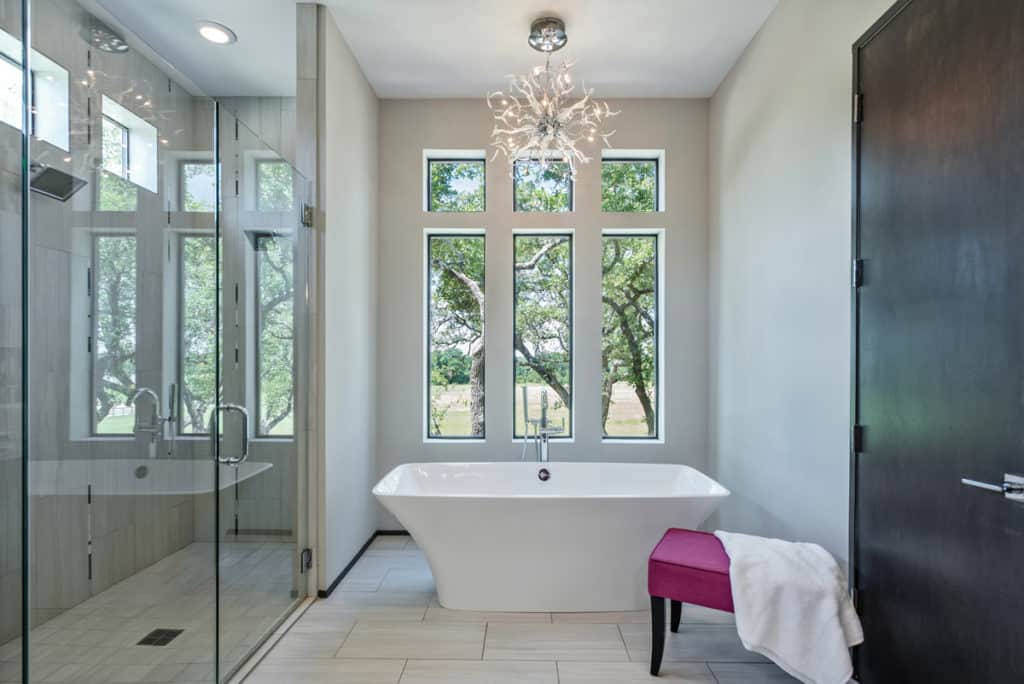 There is a bathtub in the middle of the bathroom.