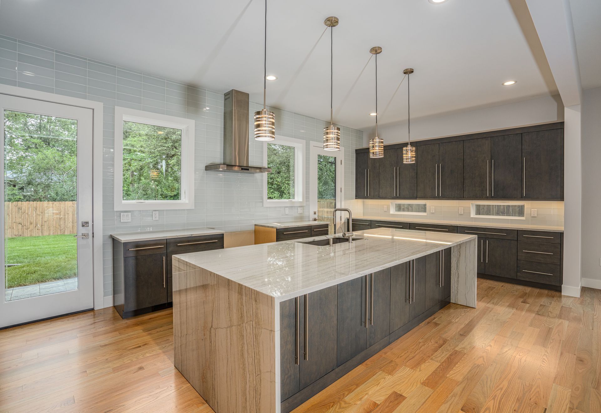 A kitchen with a large island in the middle of the room.