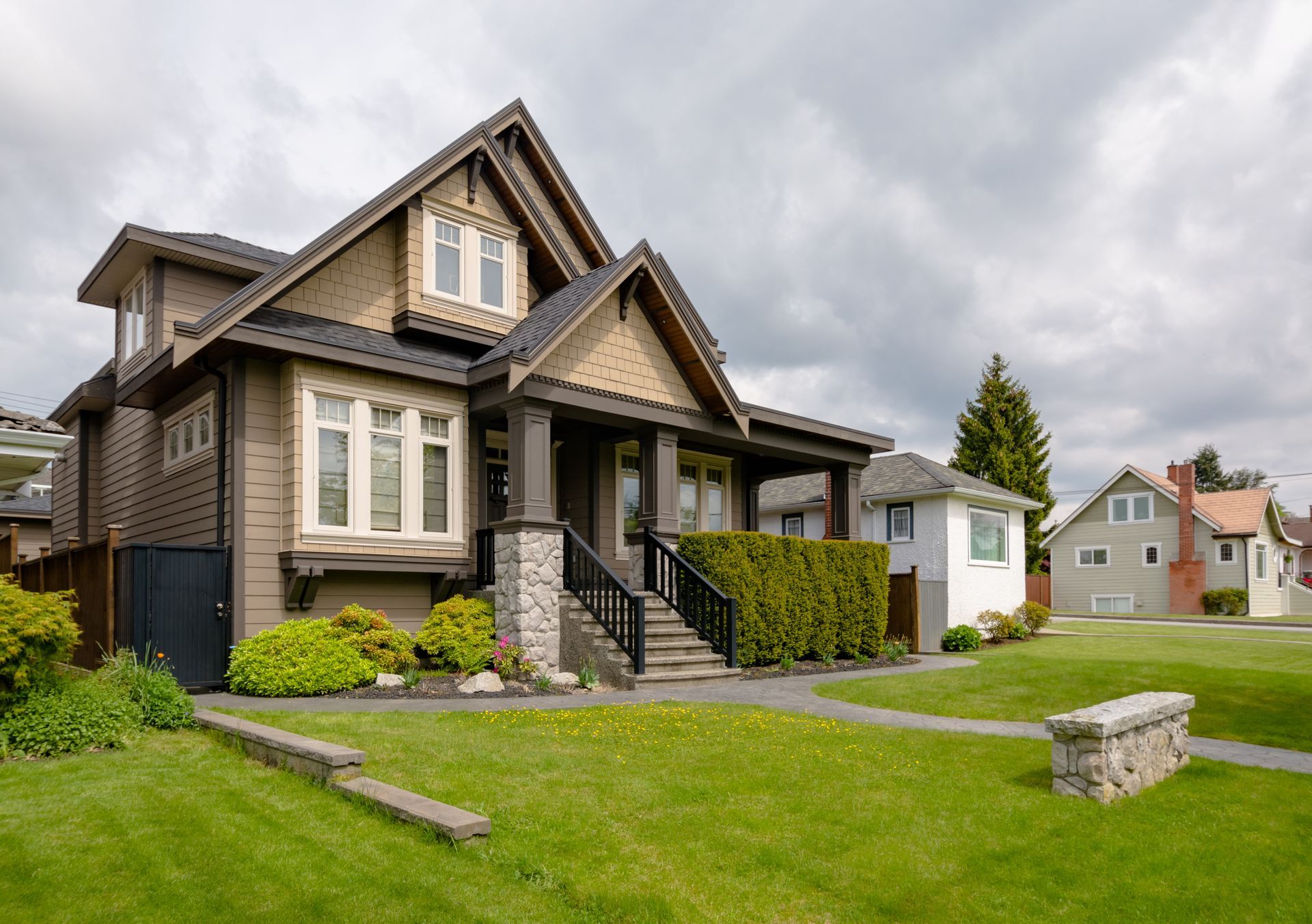 A large house with a large lawn in front of it.