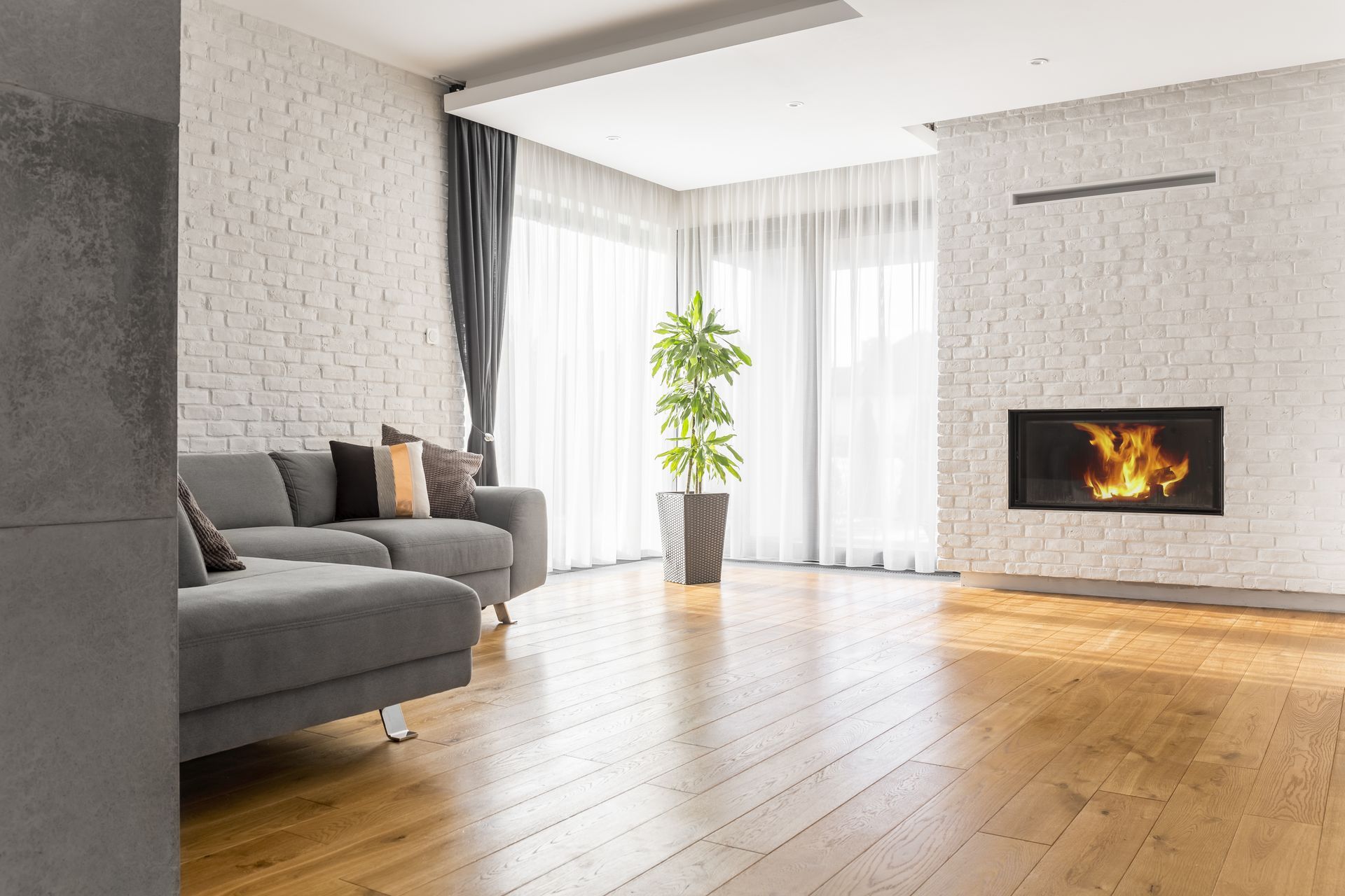 A living room with a fireplace and a couch.