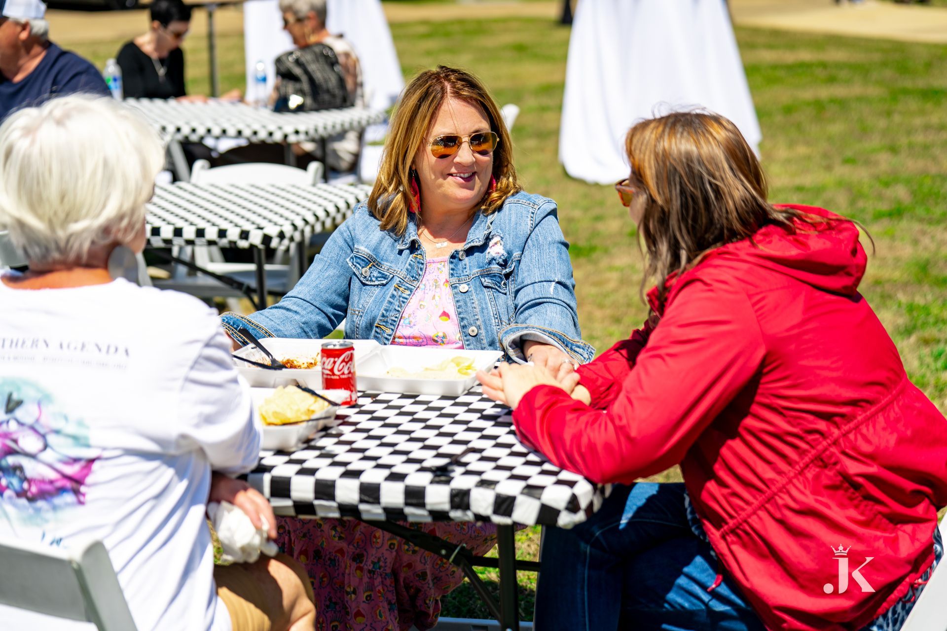 A group of people are sitting at a table eating food.