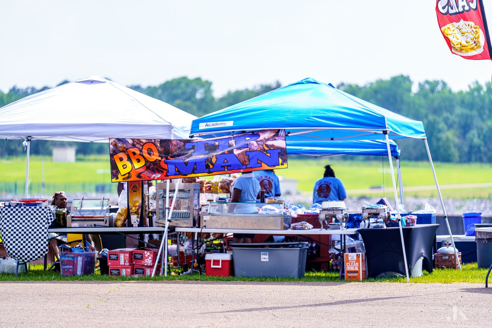 A group of tents sitting on top of a dirt field.