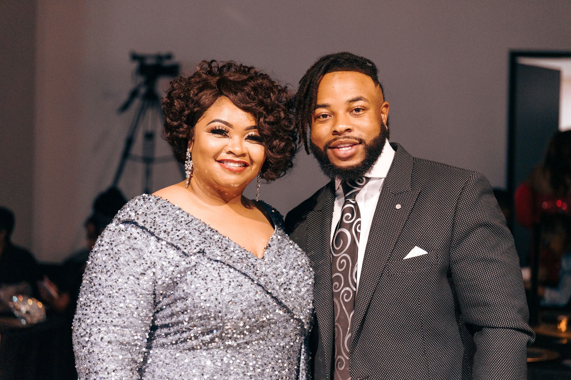 A man and a woman are posing for a picture together.
