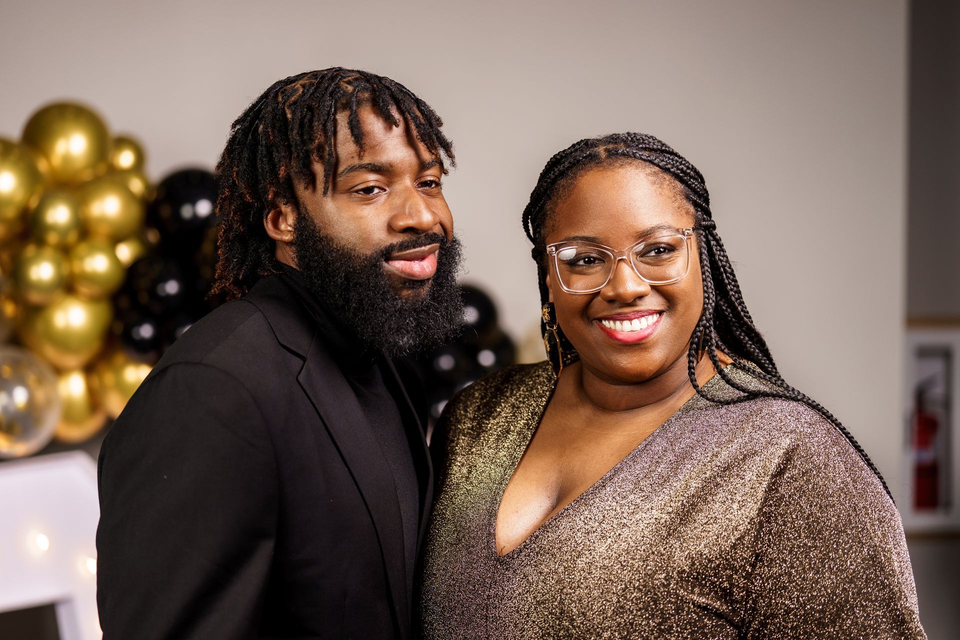 A man and a woman are posing for a picture together.