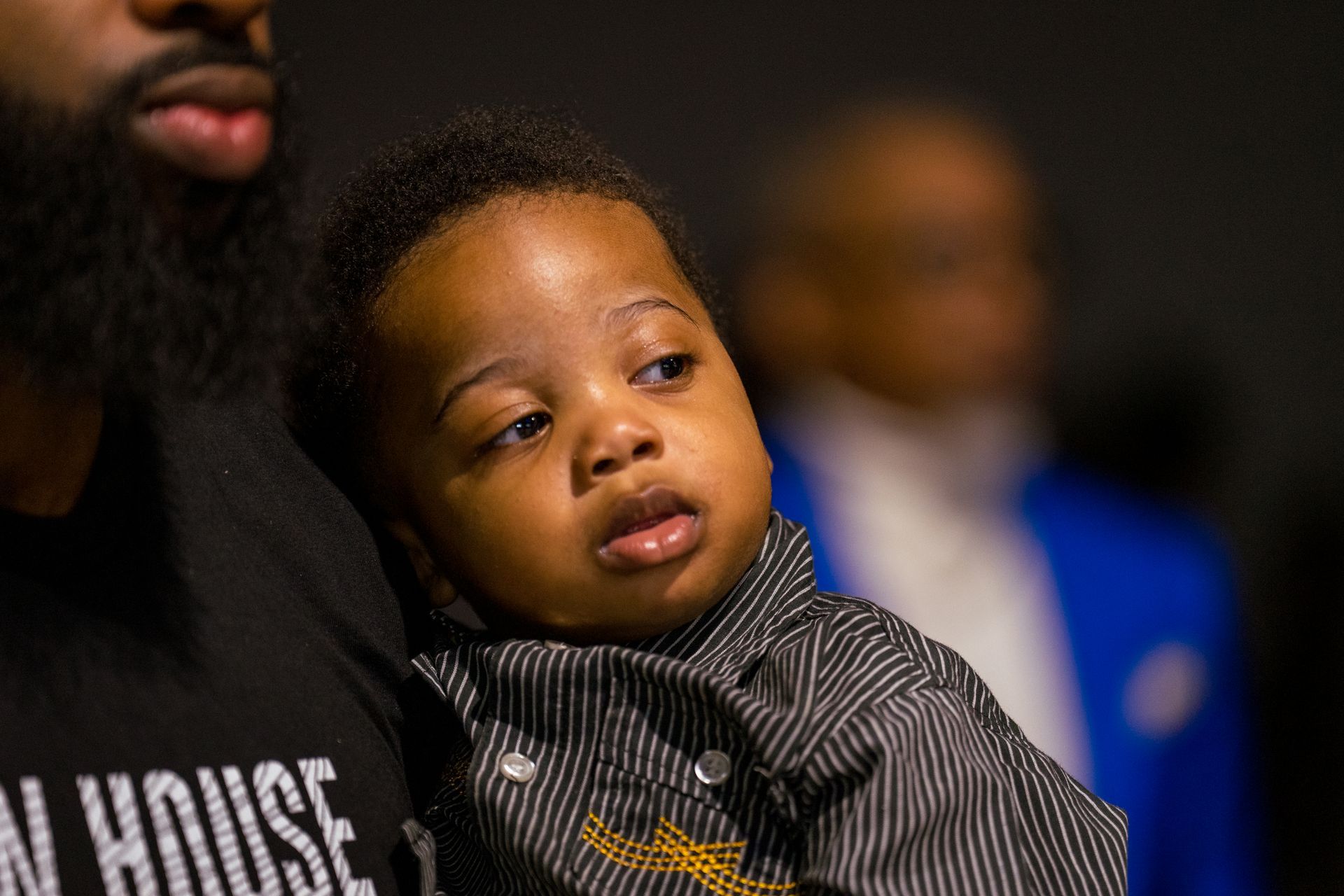 A man is holding a baby in his arms.