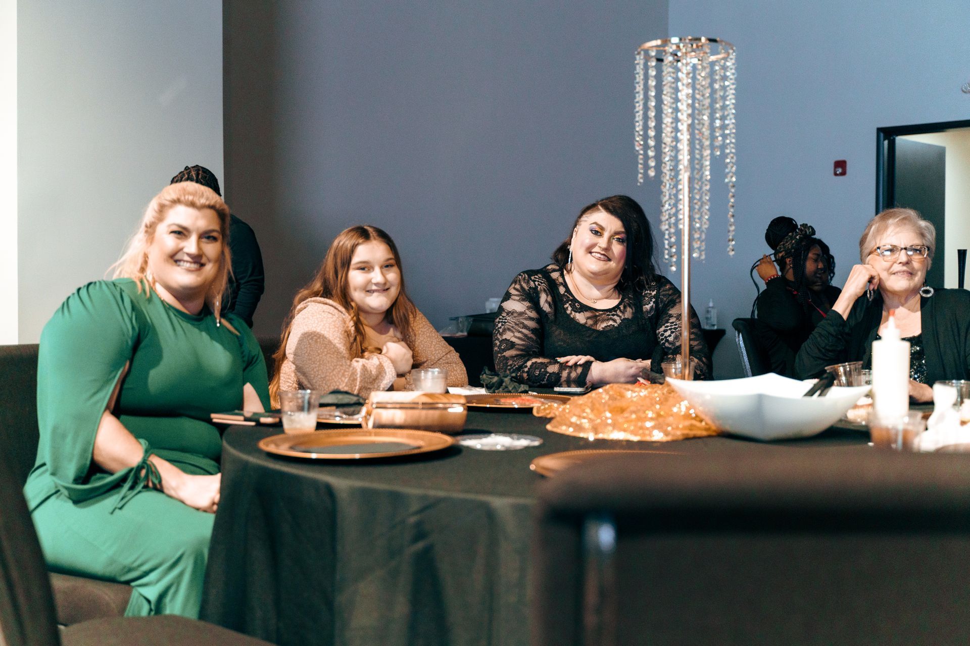 A group of women are sitting at a table.