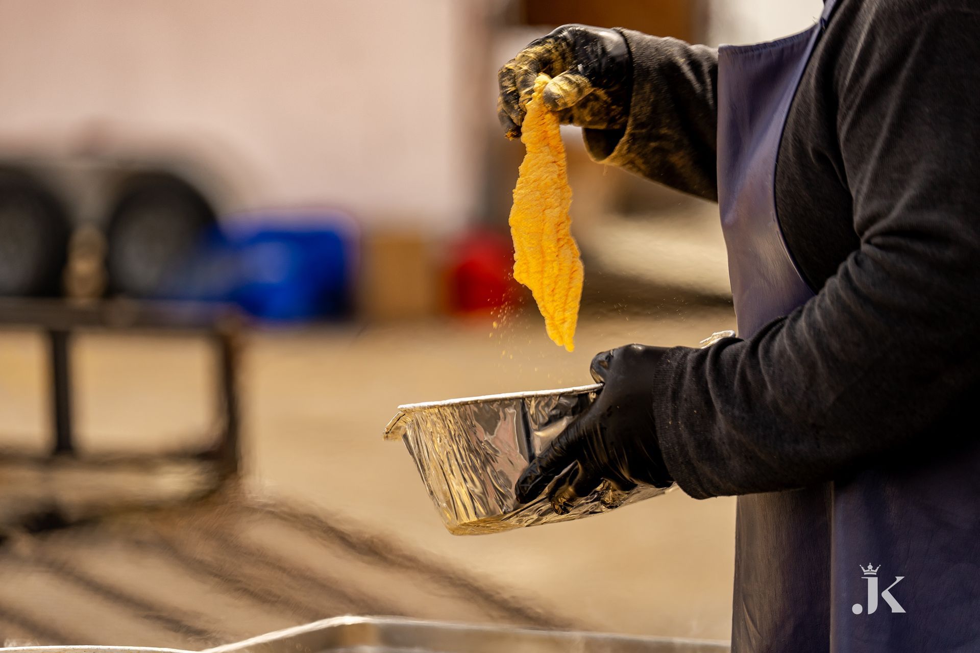 A person is holding a piece of food in their hand.