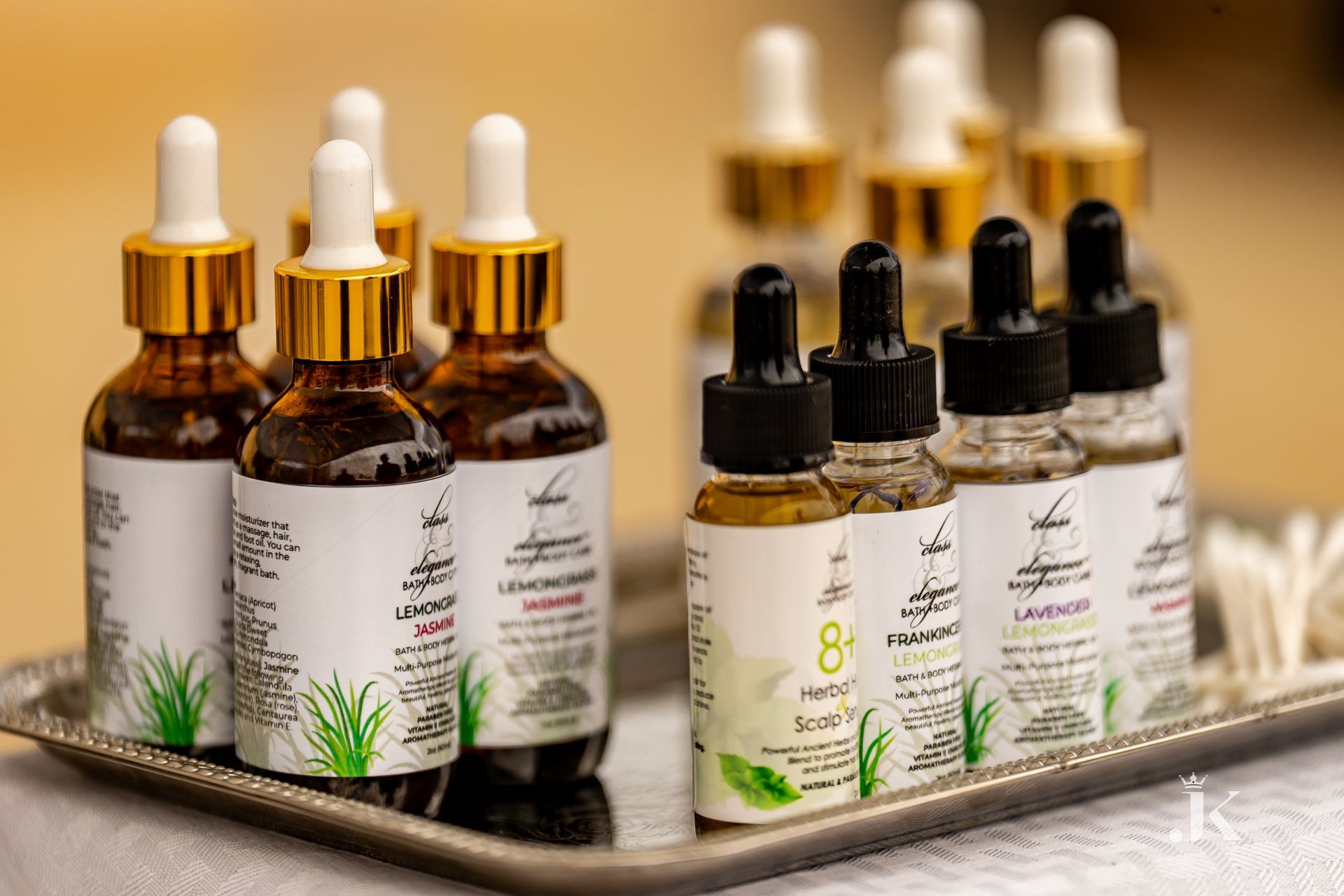 A tray of bottles of essential oils on a table.