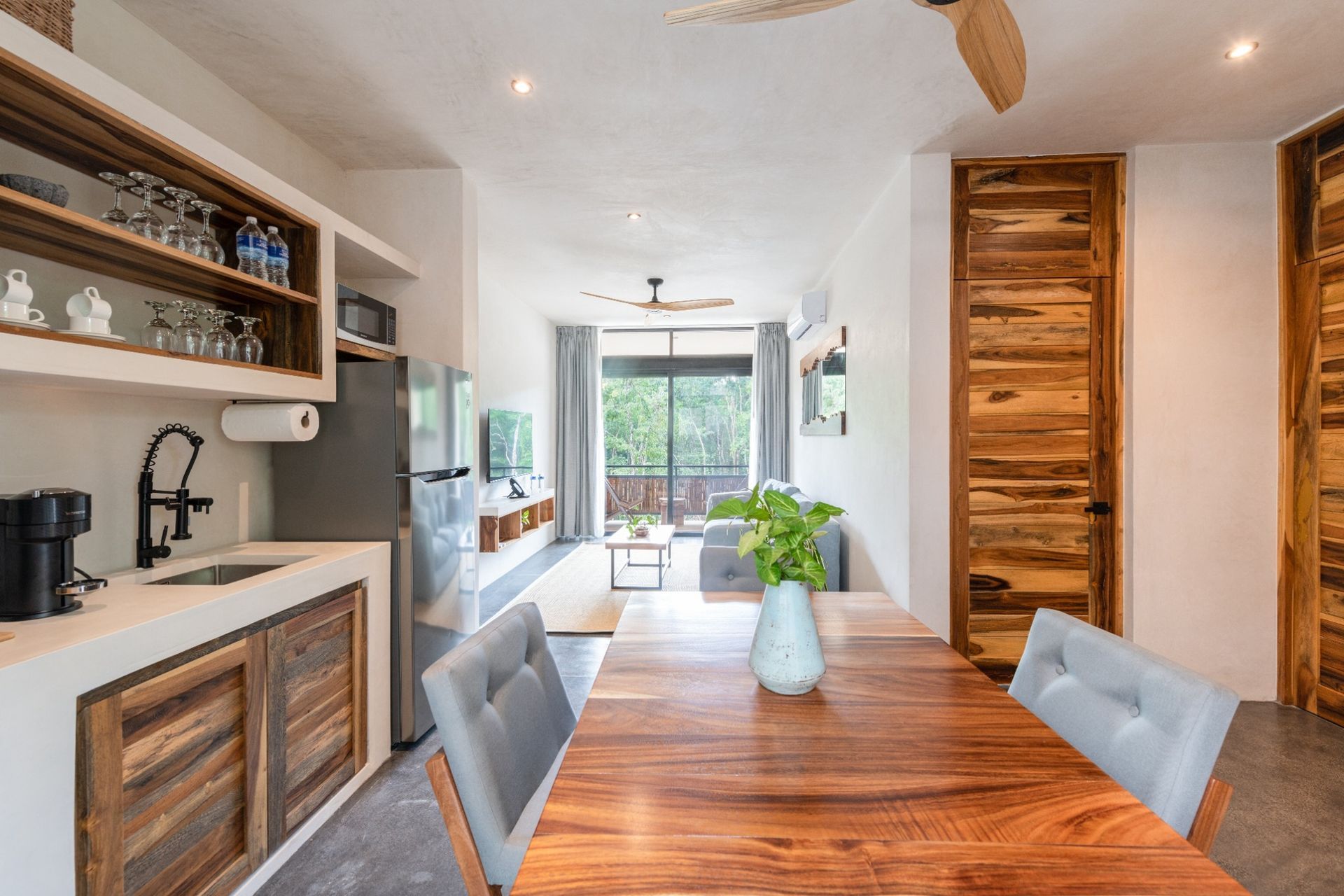 Kitchen and dining area to apartment with balcony