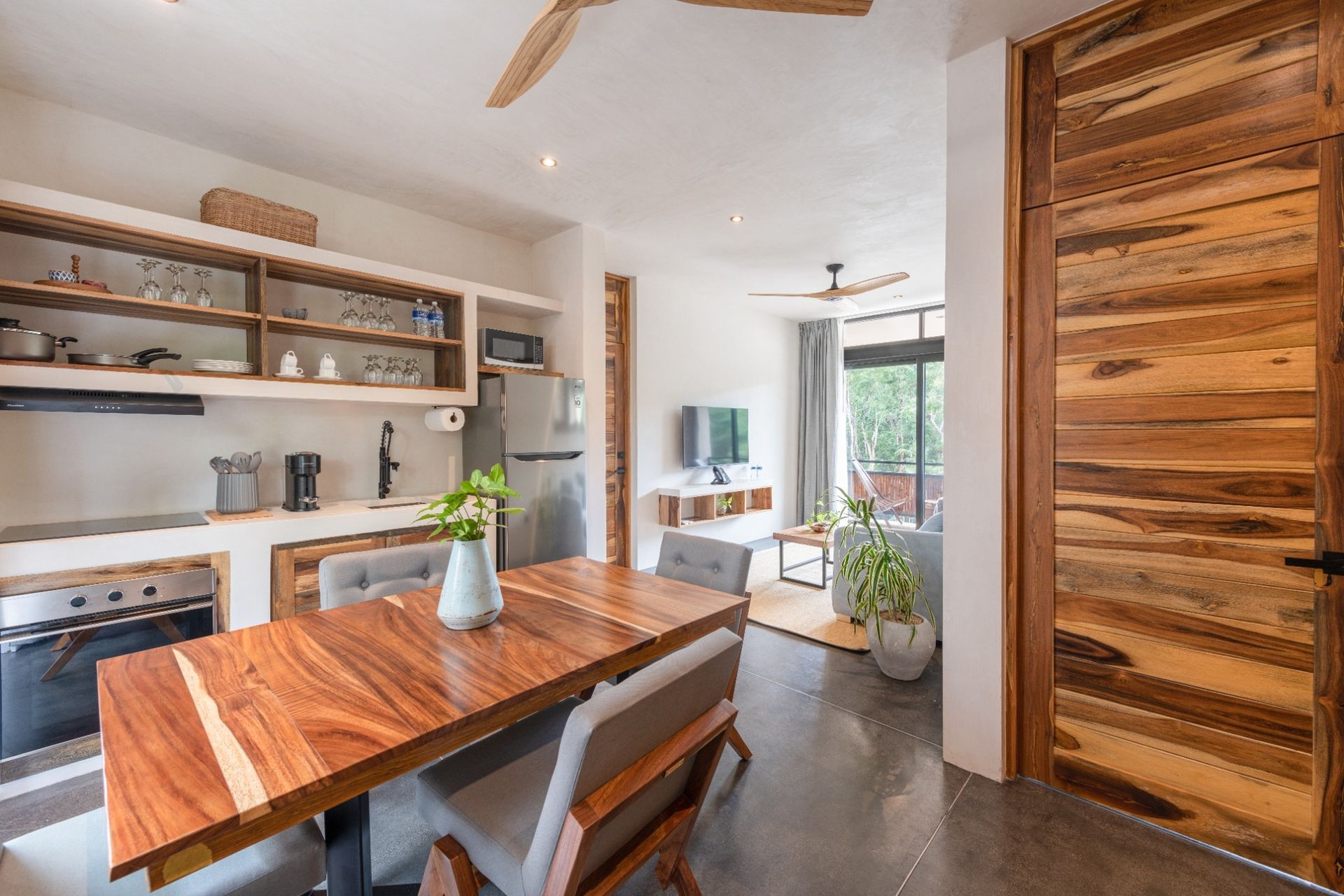 Kitchen and dining area to apartment with balcony