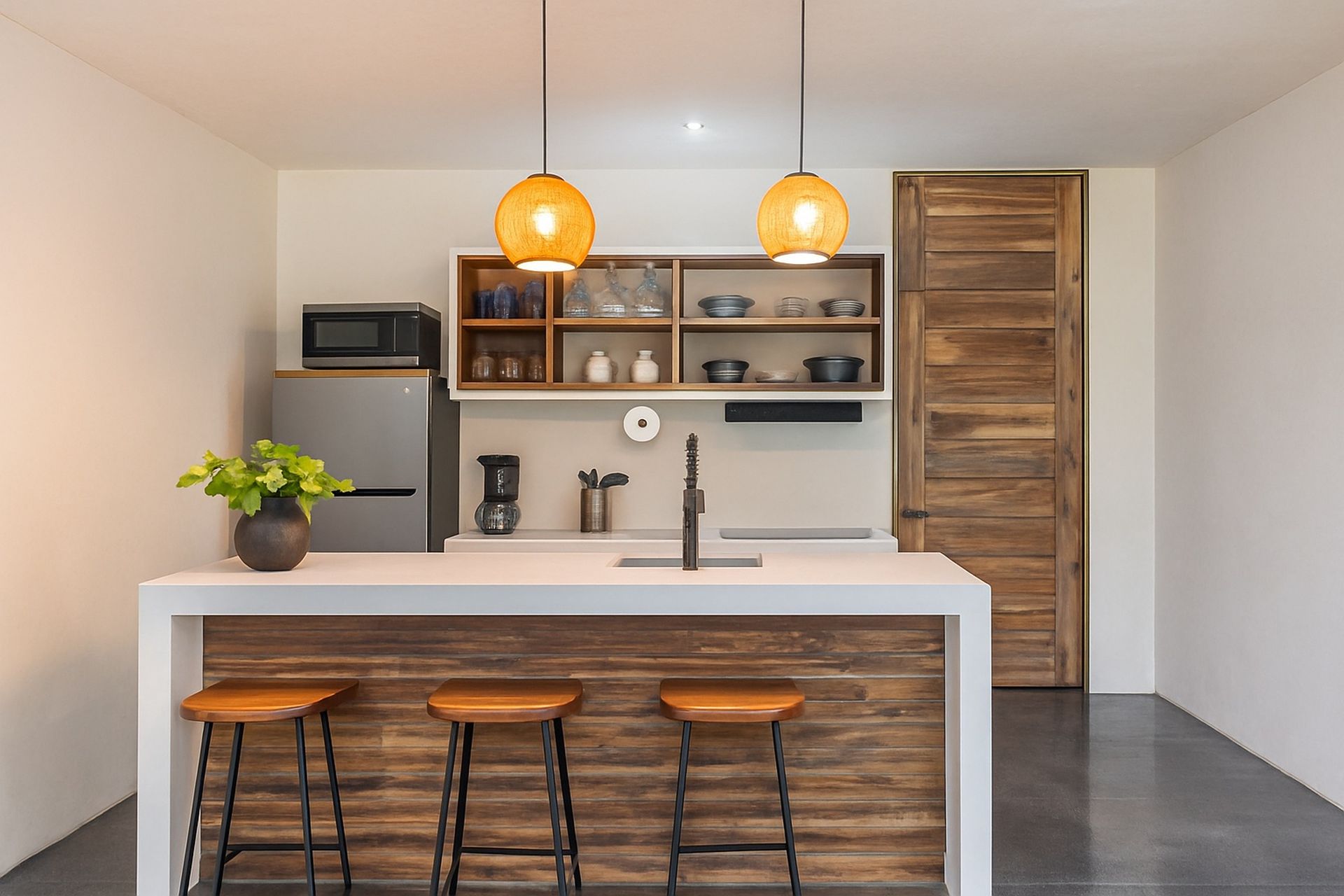 Living room and kitchen area to apartment with pool views