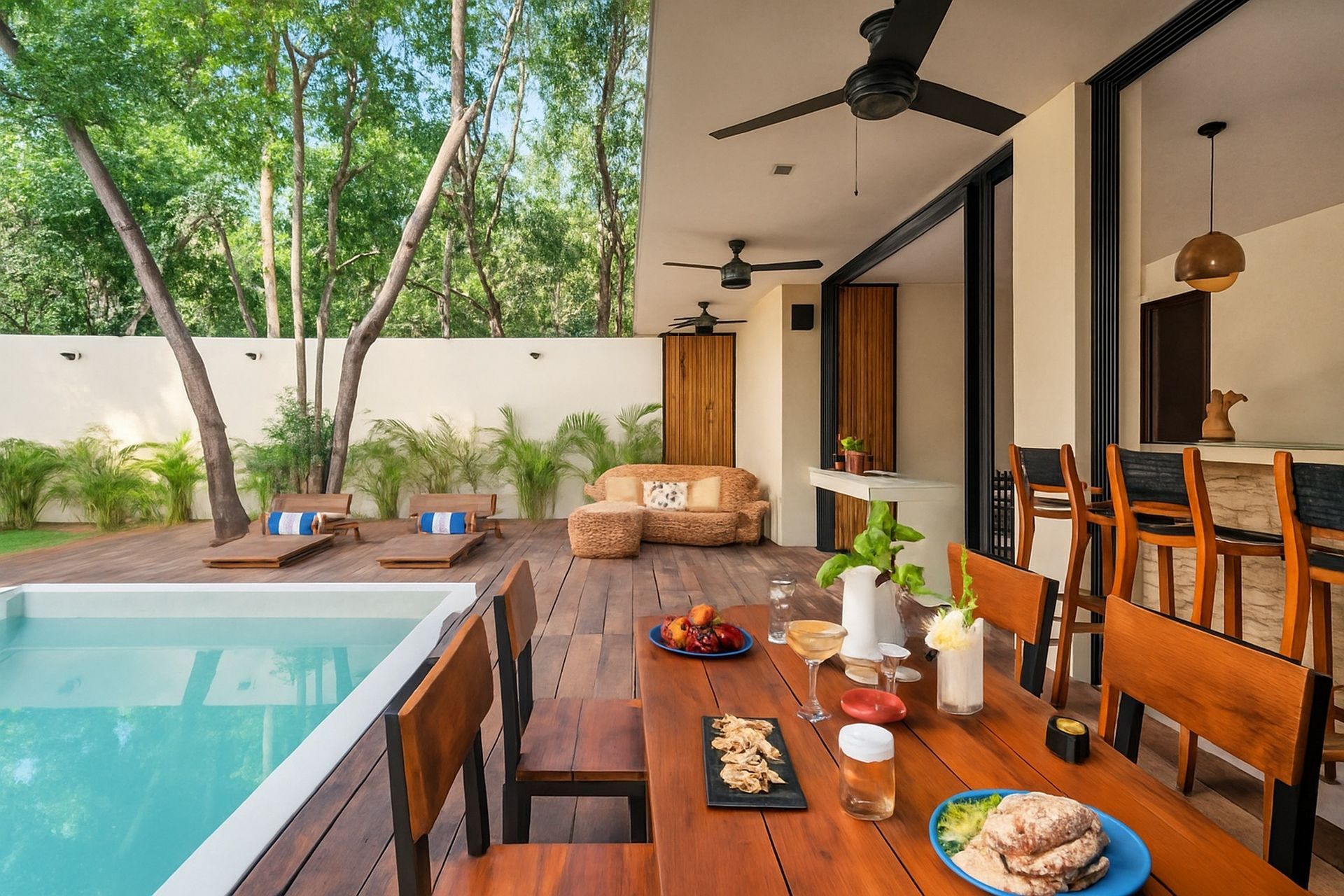 Patio with pool, dining table set for meal, seating area, and wooden deck.