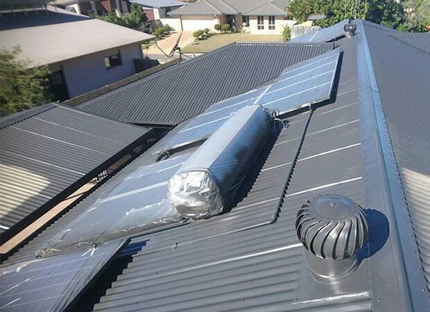 Solar Panels On The Roof — Roof Restoration in Dundowran, QLD