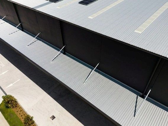 A brown roof featuring two windows, providing natural light and ventilation to the space below. A brown roof featuring two windows, providing natural light and ventilation to the space below.