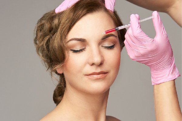 Woman receives PRP facelift injections