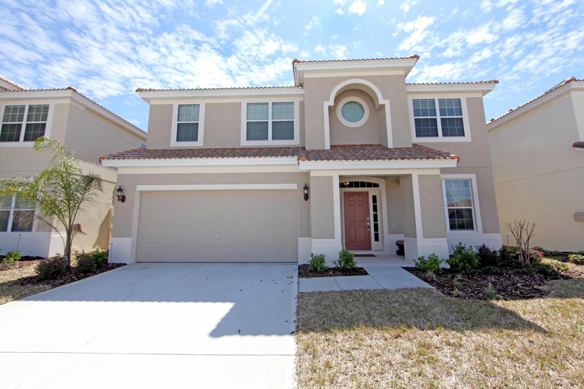 house with concrete driveway