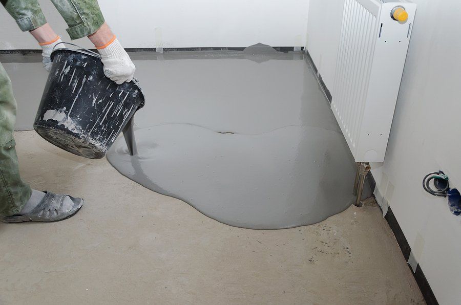 man putting epoxy for flooring