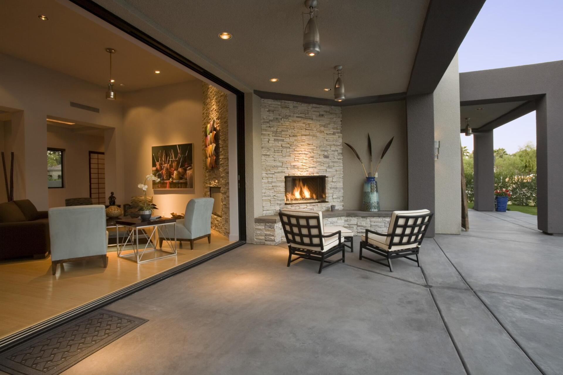 concrete backyard with fire place