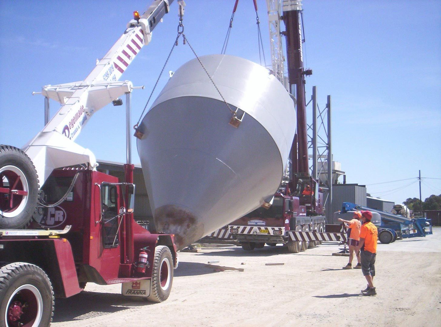 A Large Metal Object Is Being Lifted by A Crane — Magnum Steel In Crestwood, NSW