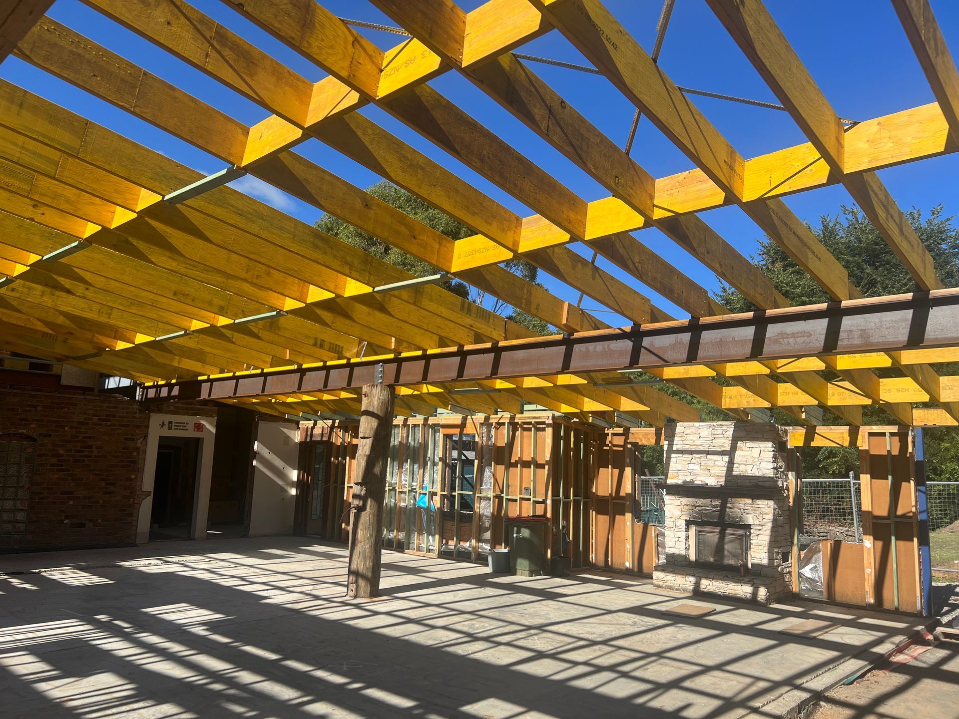 A building under construction with a lot of wooden beams — Magnum Steel In Crestwood, NSW