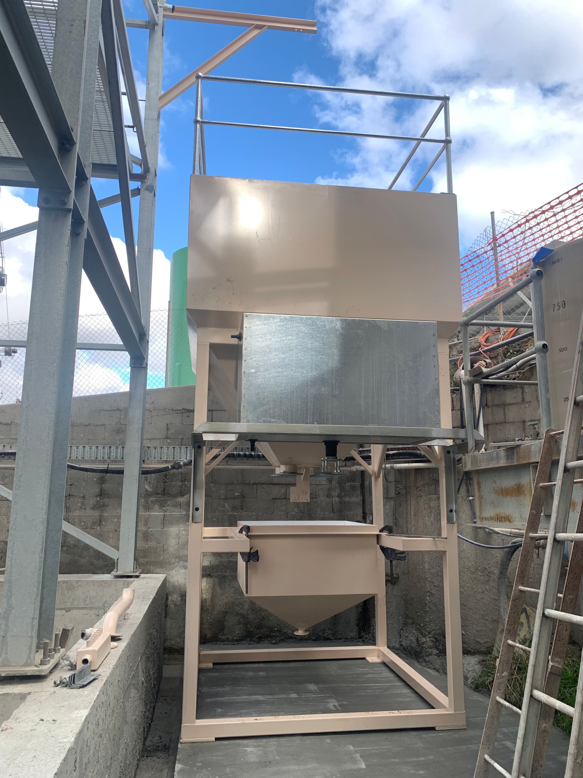 A large metal structure with a ladder in front of it — Magnum Steel In Crestwood, NSW