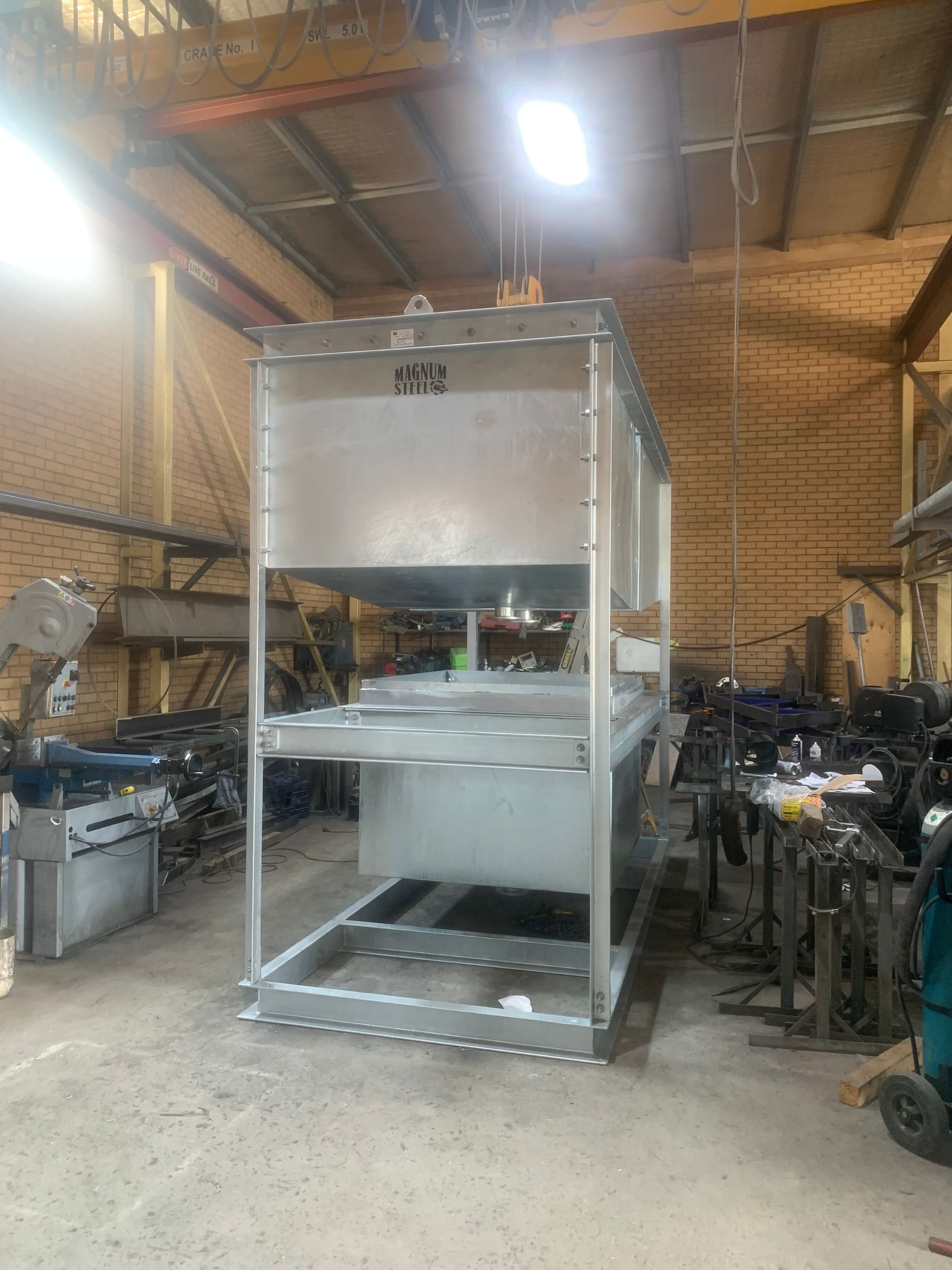 A large stainless steel container is being built in a factory — Magnum Steel In Crestwood, NSW