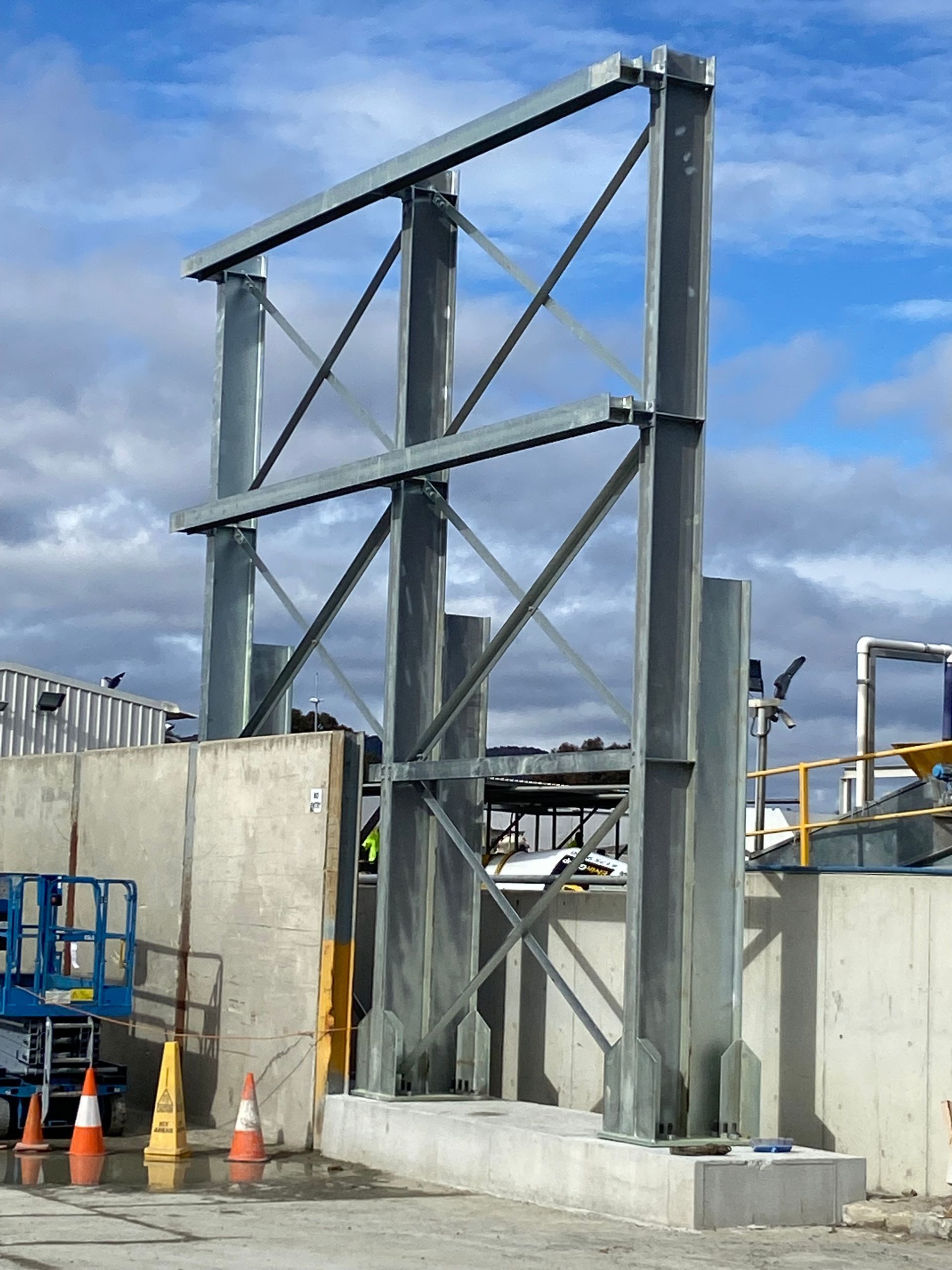 A large metal structure is being built on a construction site — Magnum Steel In Crestwood, NSW
