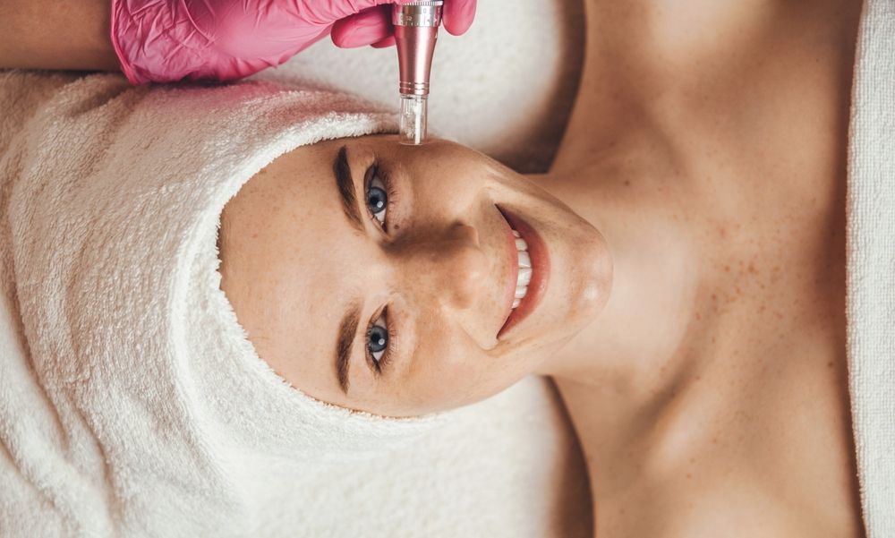 A woman is getting a facial treatment at a spa.