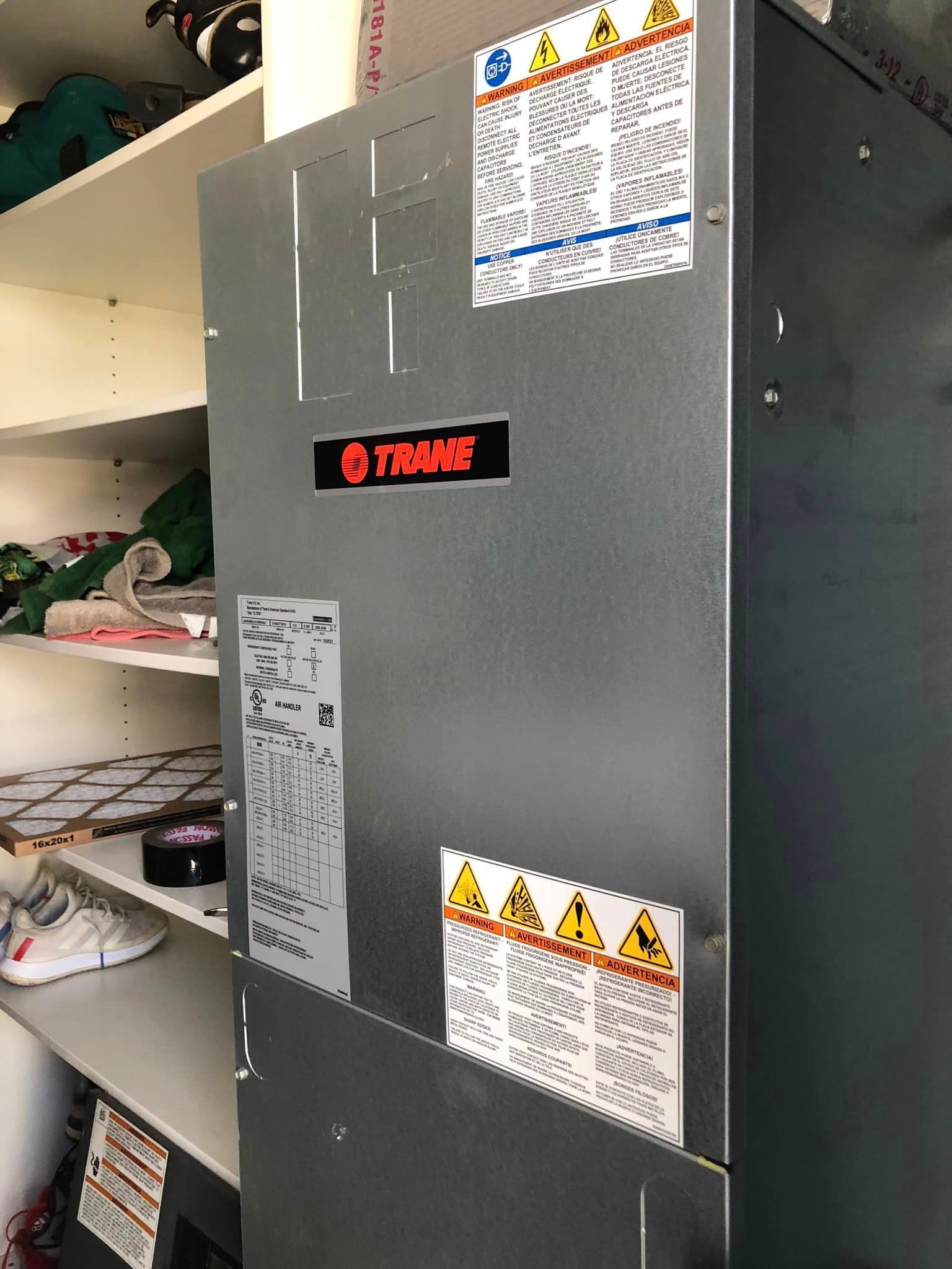 A refrigerator with a sticker on it that says flame on it.