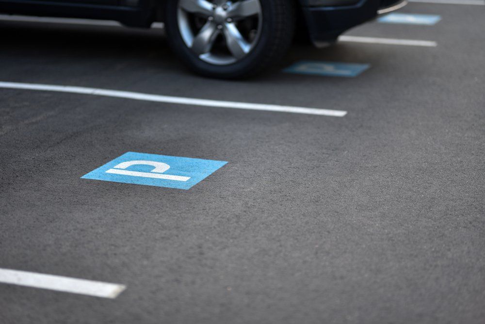 Parking Lot Asphalt — Worker Paving the Road in Charlotte, NC