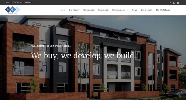 Modern apartment building facade; brick and dark gray with text: 