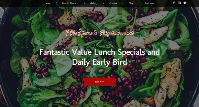 Restaurant homepage with a salad of greens, chicken, and pomegranate.