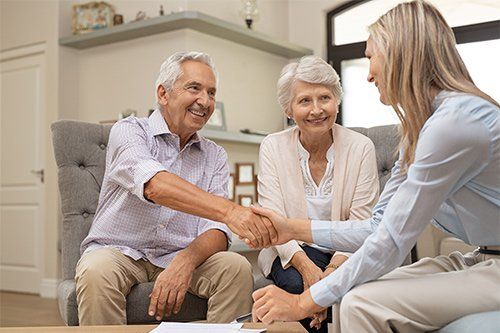 Senior Couple Talking To Financial Advisor