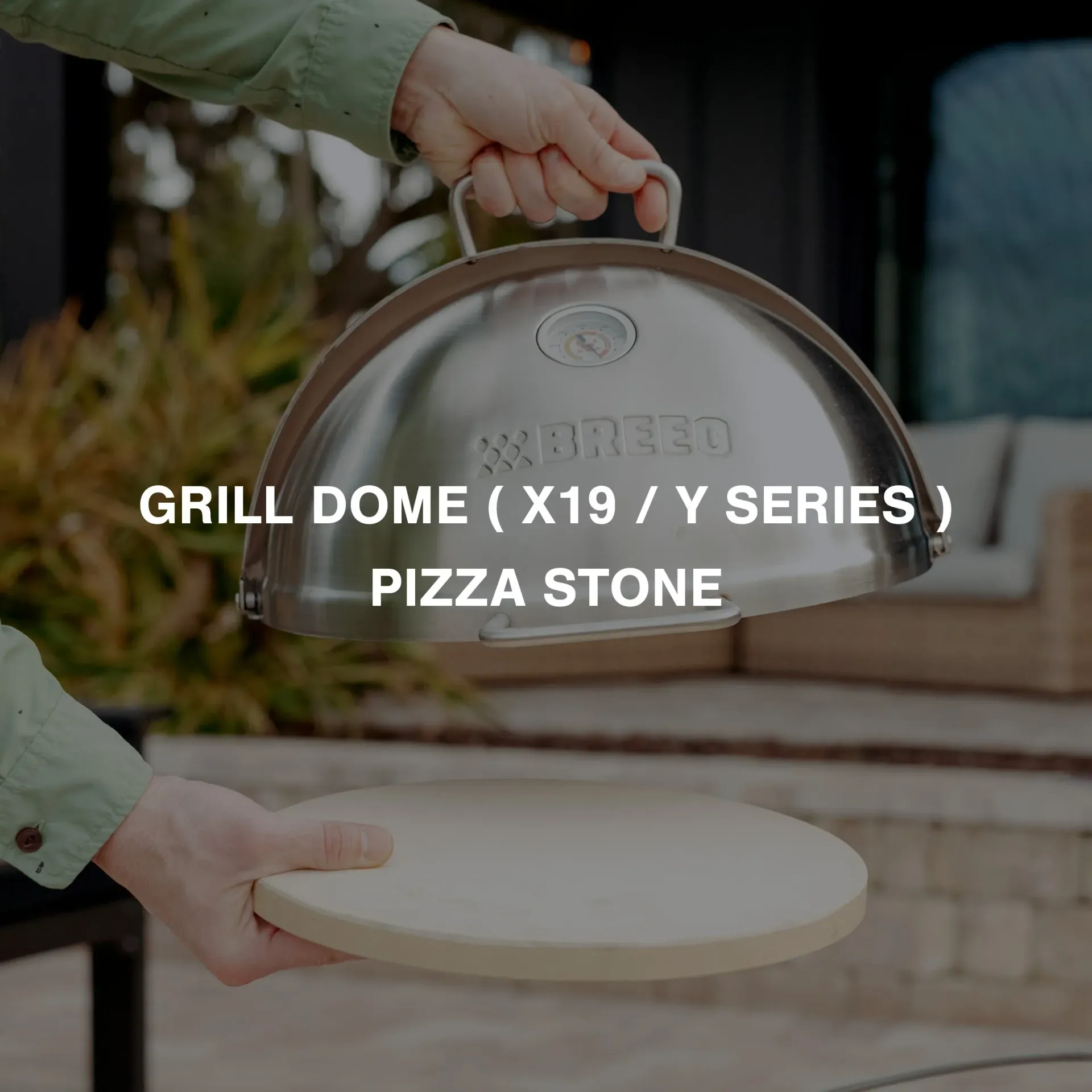 Person holding a silver grill dome over a pizza stone on a patio, with product text overlay