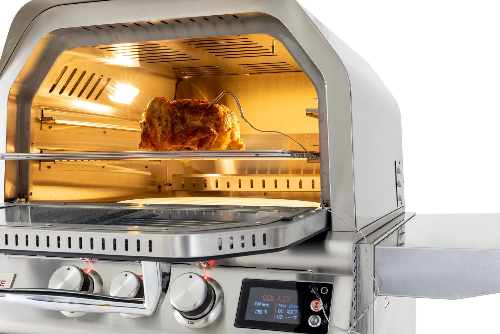 Roasted chicken in a countertop convection oven with warm interior lighting