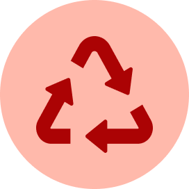 A red circular icon featuring a central circle surrounded by eight short, evenly spaced radiating lines, representing a sun.