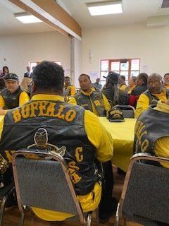 Men wearing yellow shirts and vests with 