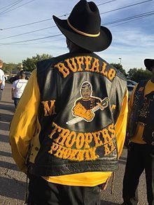 Man in black leather vest with 