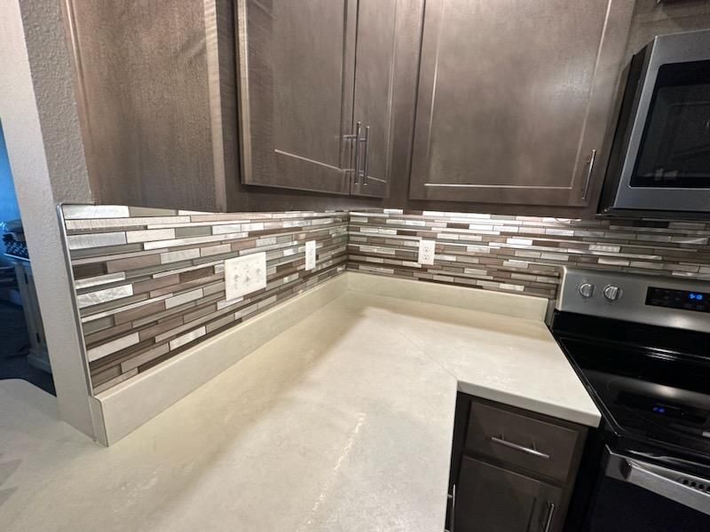 A Kitchen With A Tile Backsplash — Spirit Lake, IA — Luke's Construction