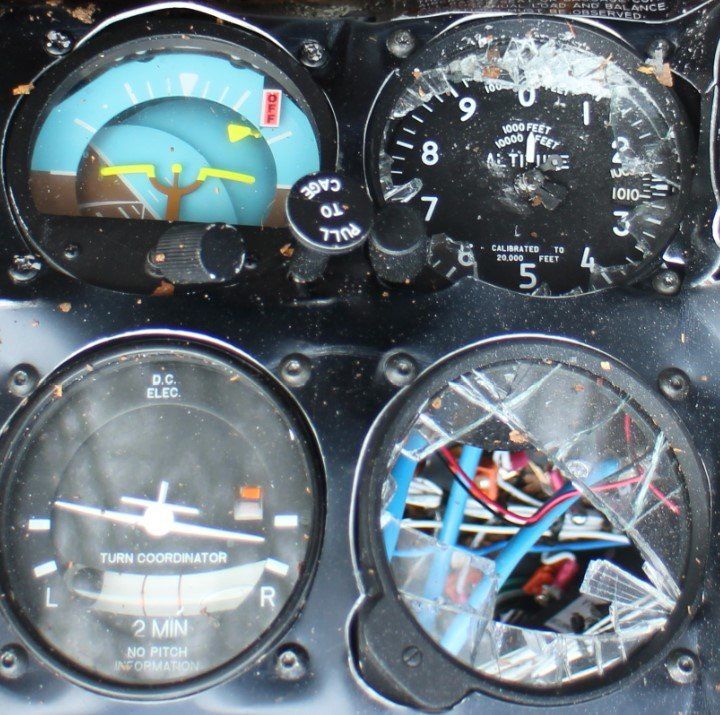 A broken dashboard with a tachometer that says 2 min