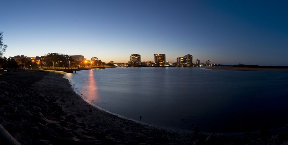 A Large Body Of Water With A City In The Background — Gympie/Childers Towing Pty Ltd in Sunshine Coast, QLD