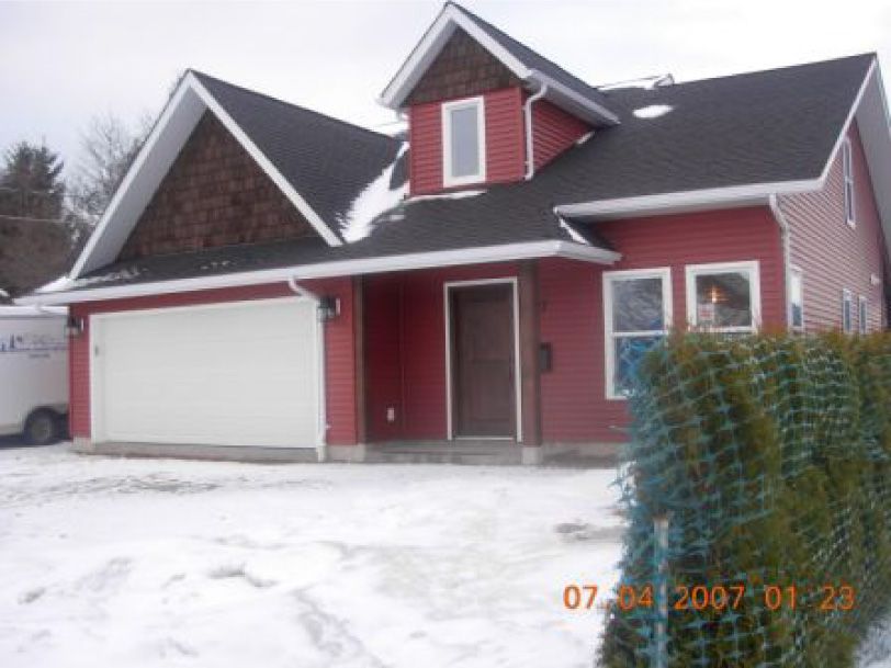 A photo of a red house taken on january 24 2007