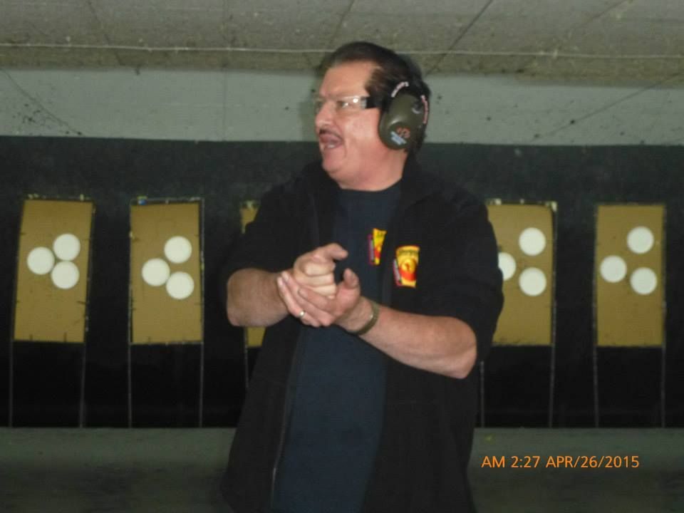 A man and a woman are practicing martial arts in a gym.