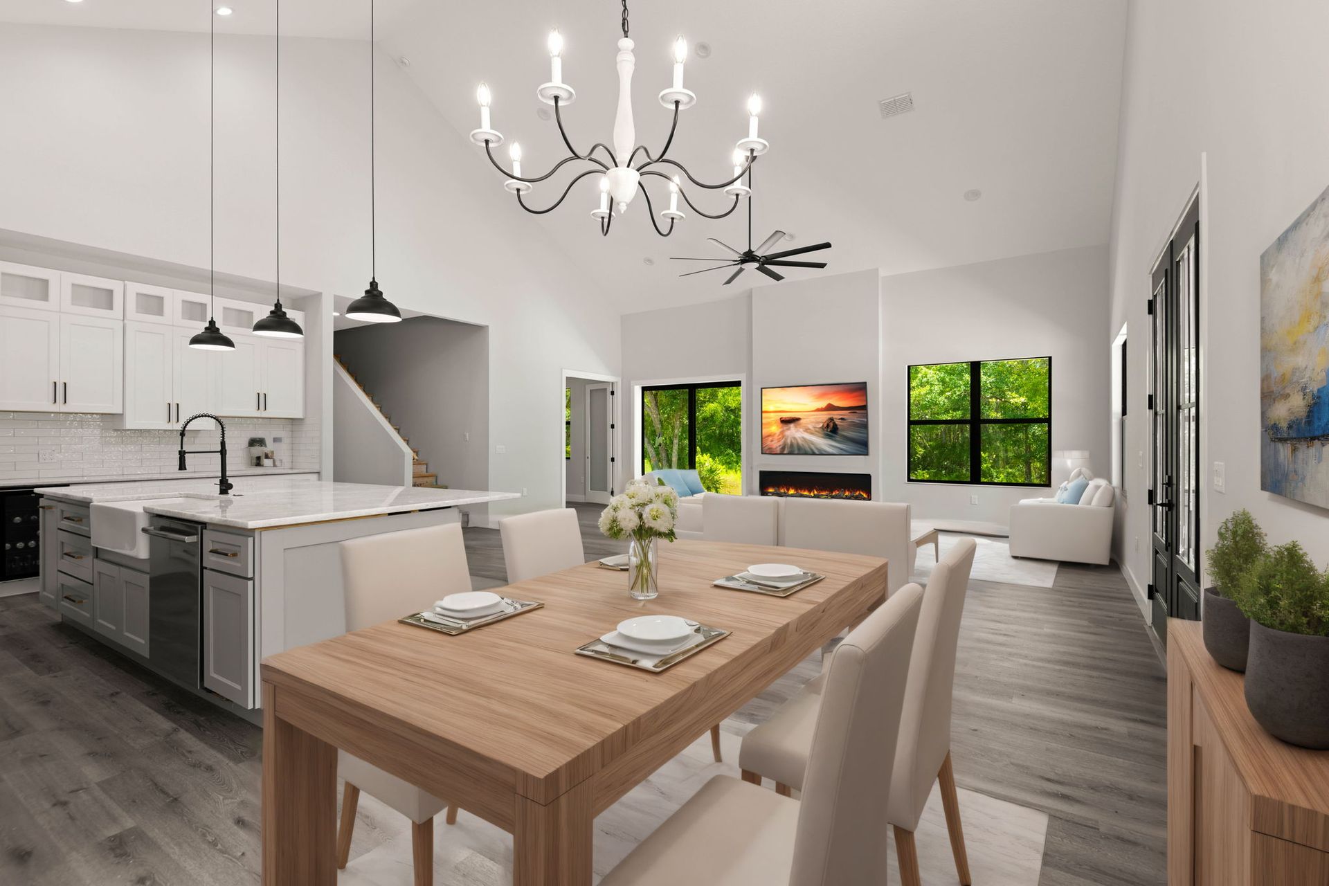 Modern open-concept living space with a kitchen, dining area, and living room featuring neutral tones and large windows.