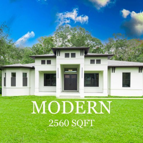 Modern white house with 2650 sq ft on a green lawn against a blue sky.