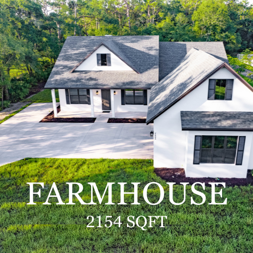 White farmhouse with black trim, surrounded by green grass and trees. 2154 sq ft.