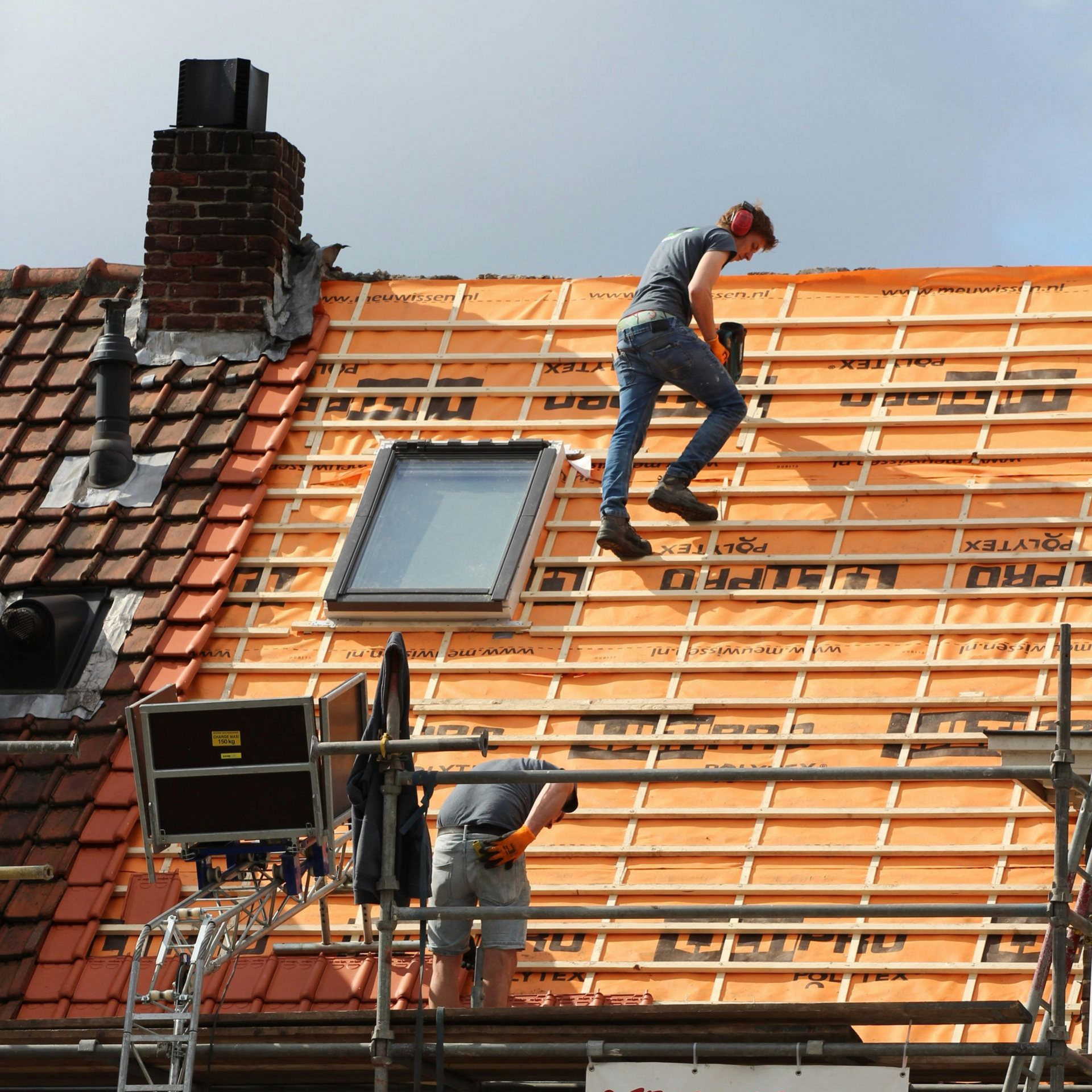 A group of thorough chimney sweepers in St Paul, MN doing chimney cleaning.