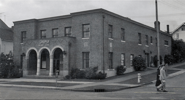 A black and white photo of a large brick building