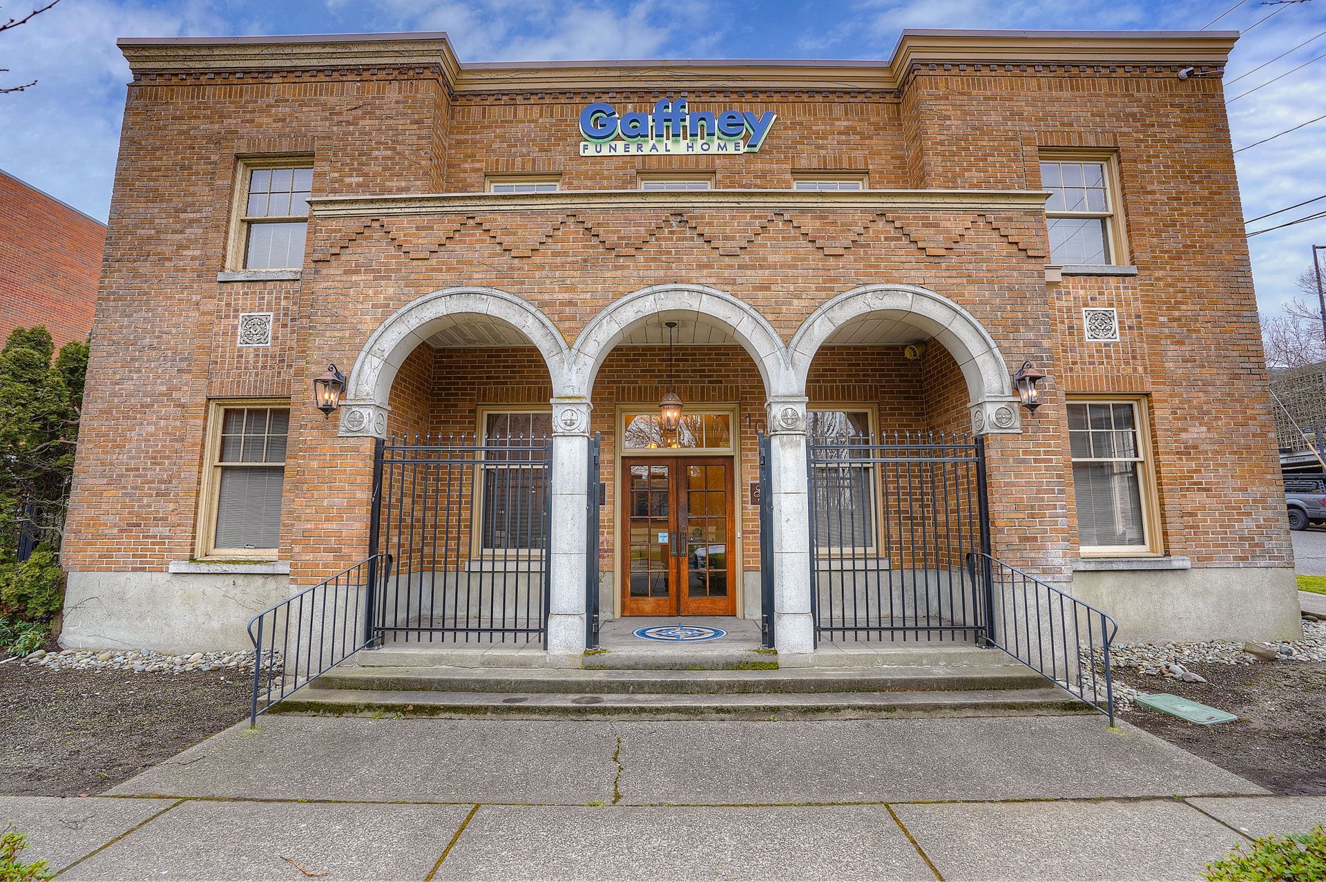 A brick building with a sign that says ' gaffney funeral home ' on it