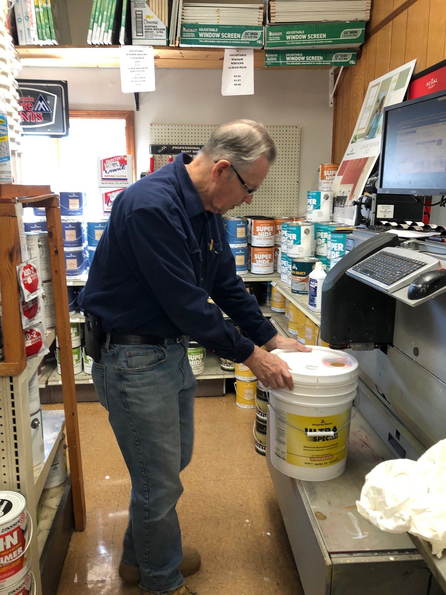 Man Looking In Tools — Port Jervis, NY — Berthiaume's Neversink Lumber Co. Inc.